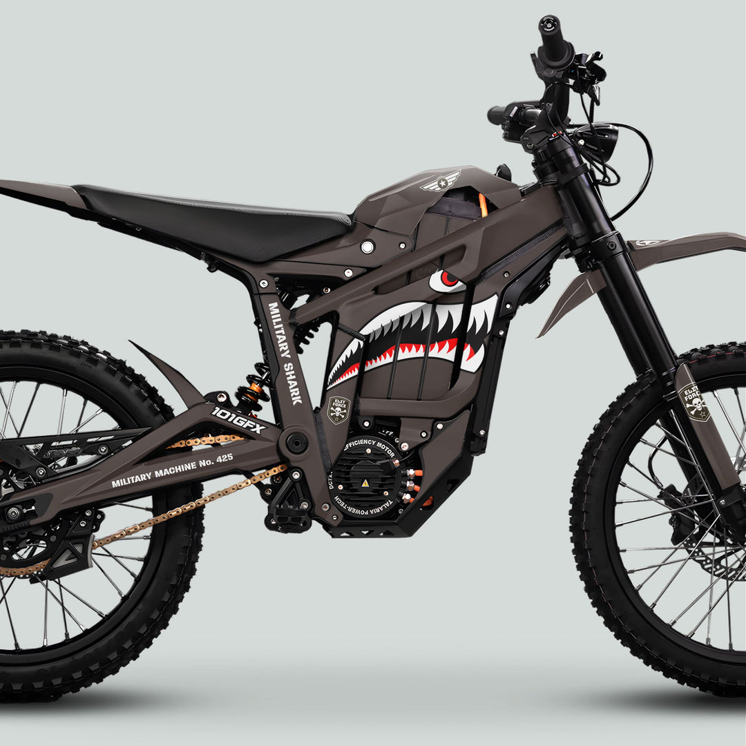 Talaria Sting MX5 PRO Graphics Kit MILITARY SHARK Earth Decals on military-themed off-road motorcycle, featuring shark-mouth graphic and stenciled markings for a bold, adventurous look.