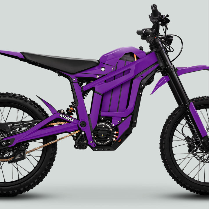 Talaria Sting MX5 PRO Graphics Kit SOLID COLOR Purple Decals on an electric dirt bike, showcasing its angular frame, knobbly tires, and motocross suspension.