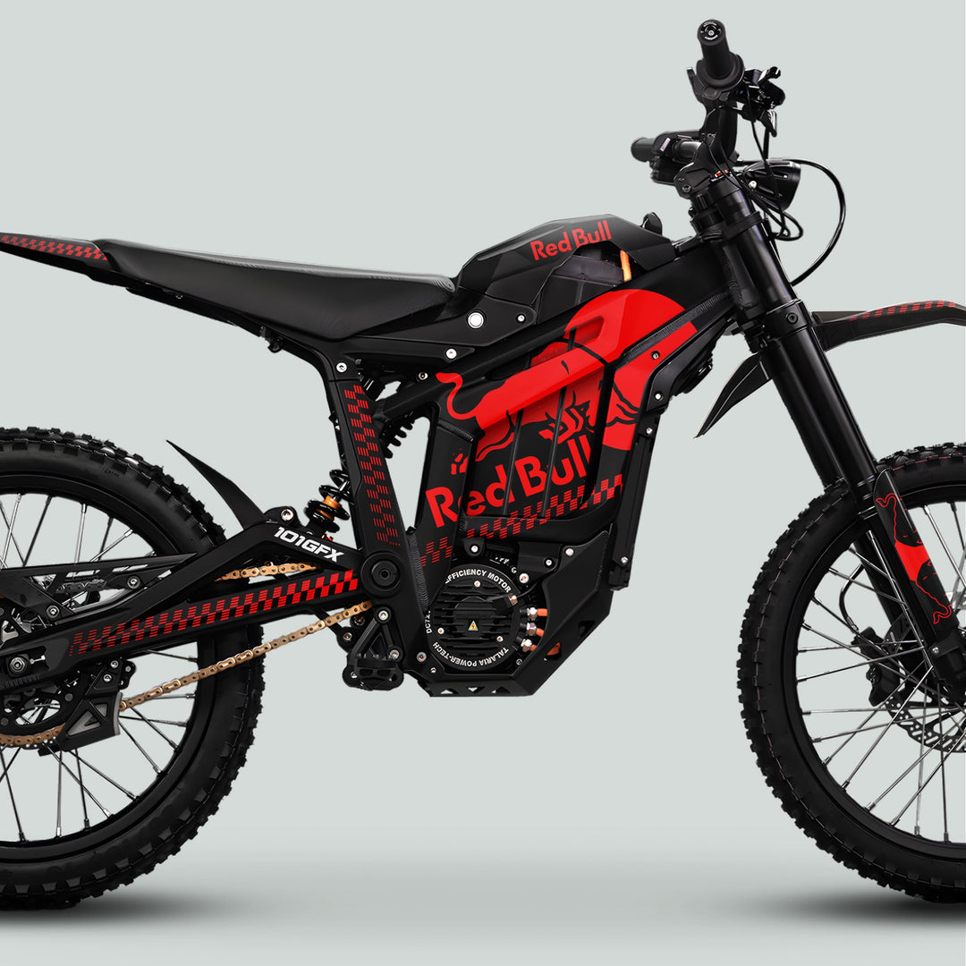 Side-on view of Talaria Sting MX5 PRO Graphics Kit RBULL MONO, showcasing Red Bull livery on an electric dirt bike's frame and battery housing.