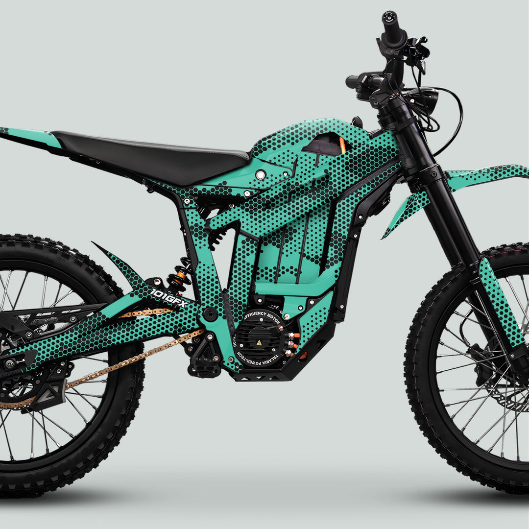Talaria Sting MX5 PRO Graphics Kit HEXOCAM MINT enhances the electric dirt bike with teal-green, hex-dot patterned bodywork, durable for off-road adventures.