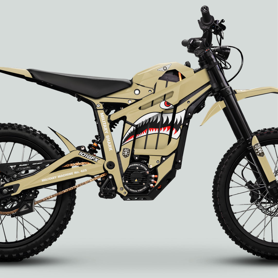 Talaria Sting MX5 PRO Graphics Kit MILITARY SHARK Sand Decals on electric dirt bike with sturdy tires, shark mouth design, and reinforced frame.