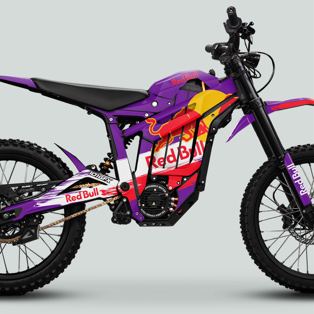Side profile of Talaria Sting MX5 PRO Graphics Kit RBULL RACE Purple Decals on an electric dirt bike, highlighting frame, motor housing, and knobby tires.