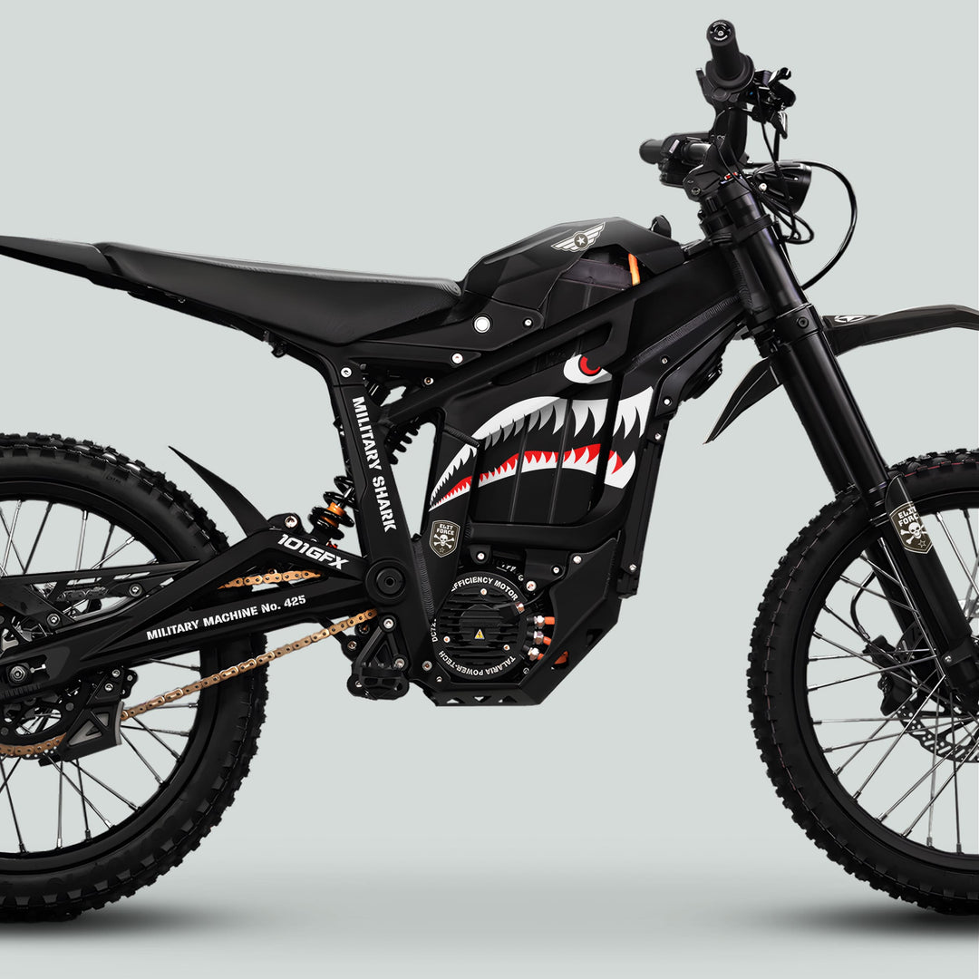 Talaria Sting MX5 PRO Graphics Kit MILITARY SHARK Black Decals adorn a black electric off-road motorcycle with shark graphics and knobbly tires.