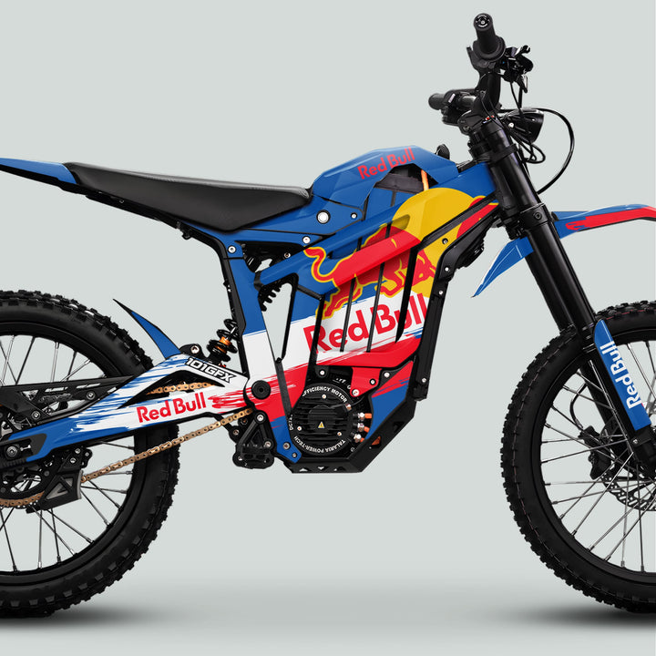 Talaria Sting MX5 PRO Graphics Kit RBULL RACE Blue Decals on an electric dirt bike with knobby tires, Red Bull branding, and motocross-style features.