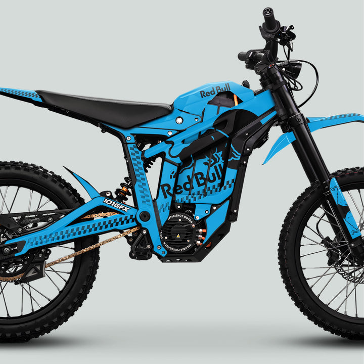 Electric off-road motorcycle with Talaria Sting MX5 PRO Graphics Kit RBULL MONO Cyan Black Decals, featuring Red Bull livery, blue frame, and off-road components.