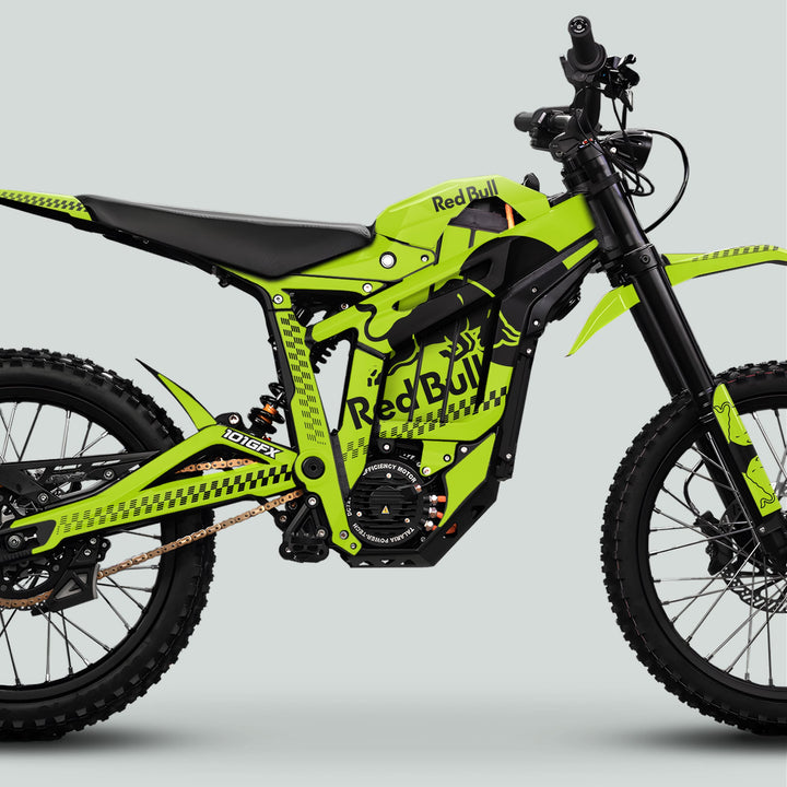 Talaria Sting MX5 PRO with high-visibility Red Bull livery, featuring a large central motor, off-road tires, and robust suspension, showcasing the RBULL MONO Green Black Decals.