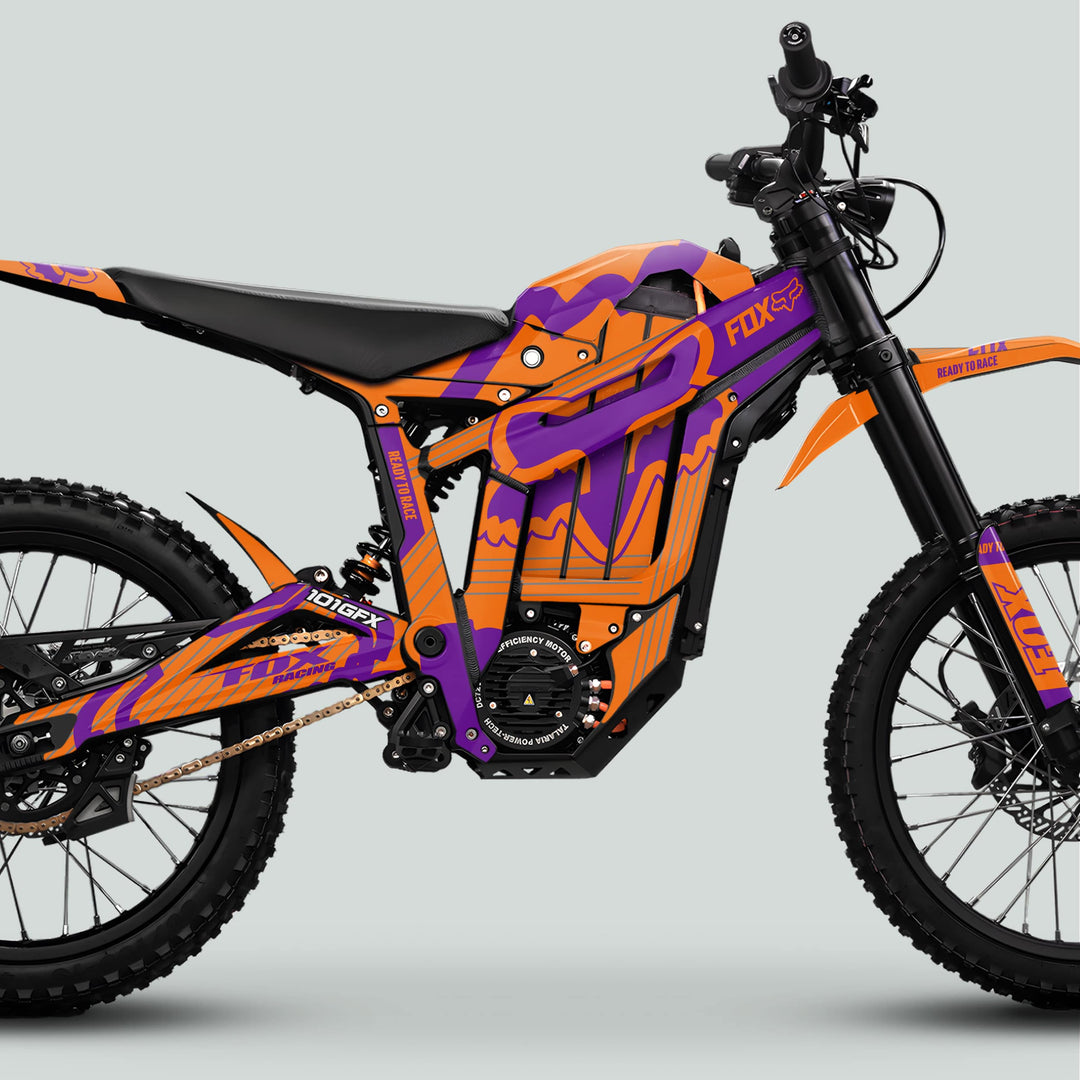 Talaria Sting MX5 PRO Graphics Kit FOX STRIPES enhances this off-road electric bike with vibrant decals, highlighting the frame, forks, and wheels for a bold look.