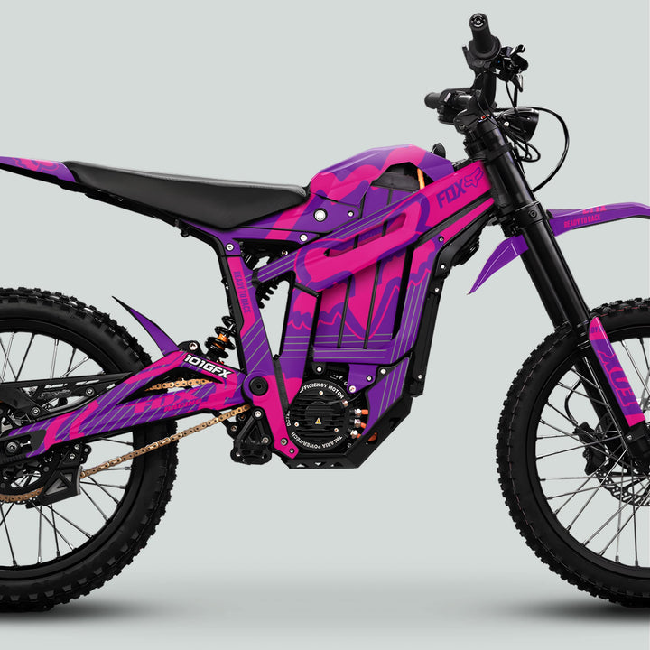 Talaria Sting MX5 PRO Graphics Kit FOX STRIPES Purple Magenta Decals adorns an electric dirt bike, featuring a battery, mid-mount motor, suspension, and off-road tires.