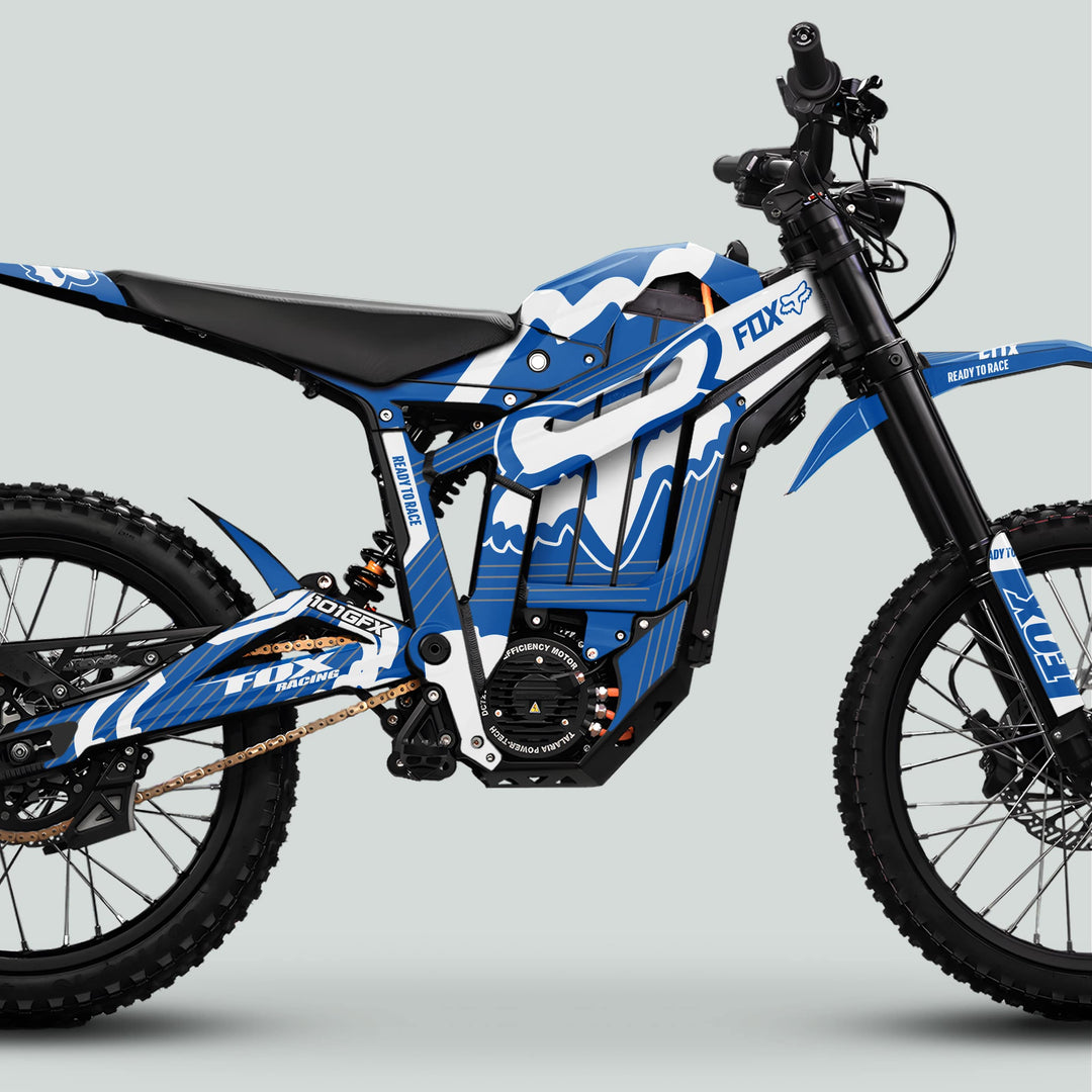 Talaria Sting MX5 PRO Graphics Kit FOX STRIPES on a motocross bike with knobby tires, suspension forks, battery, motor, chain drive, and Fox Racing branding.