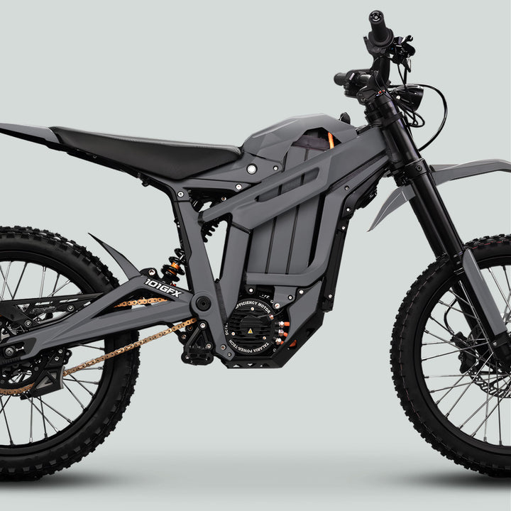 Side view of the Talaria Sting MX5 PRO with SOLID COLOR Grey Decals, showcasing off-road suspension, a central battery, and gold drive chain for enhanced style.