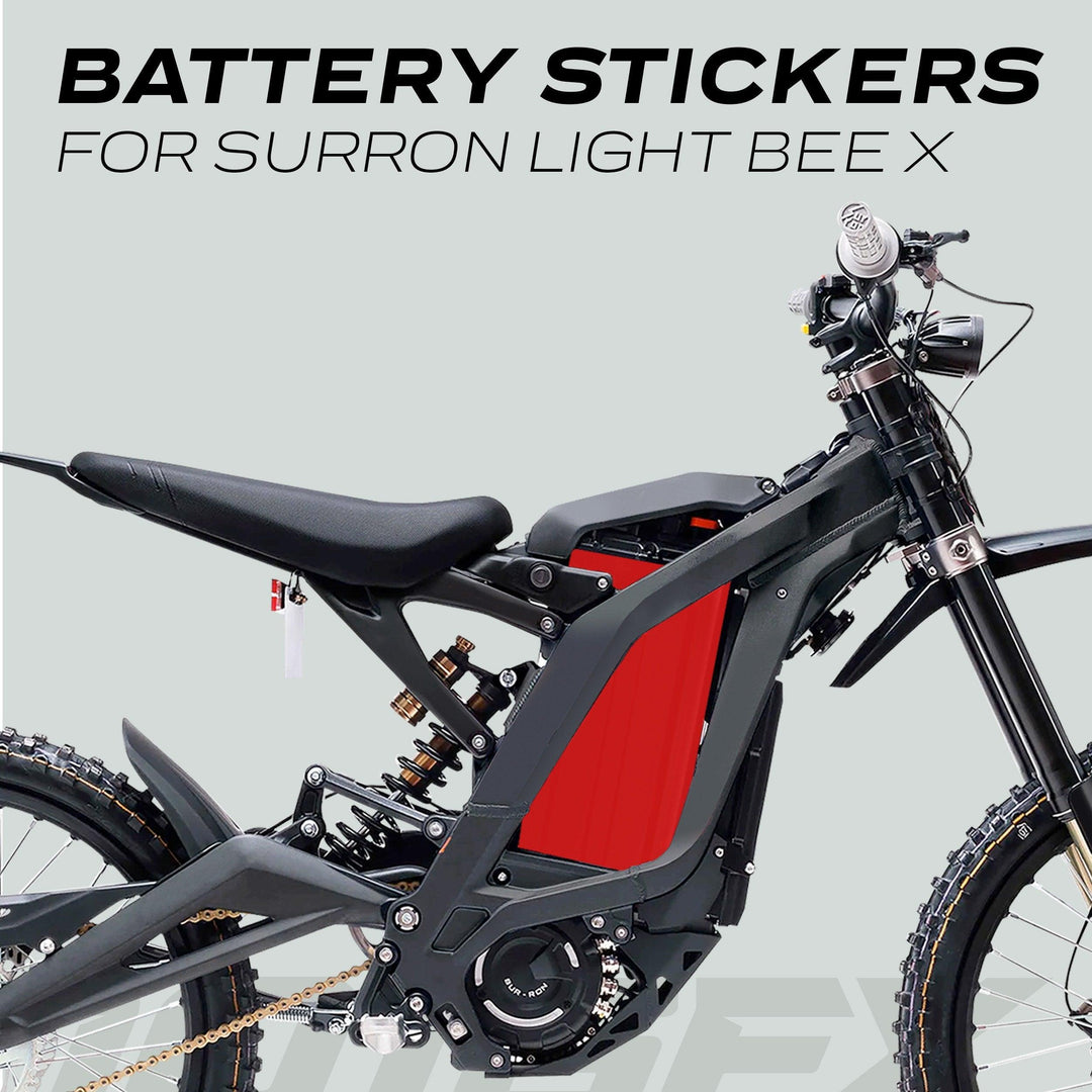 Surron Light Bee X Battery Stickers SOLID Red displayed on a bike, highlighting their custom fit, durability, and vibrant design for off-road enthusiasts.