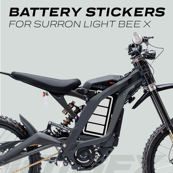 Sur-Ron Light Bee X with ICON Black White Battery Stickers featuring a charge-level graphic on the battery compartment, offering a sleek, customized look.
