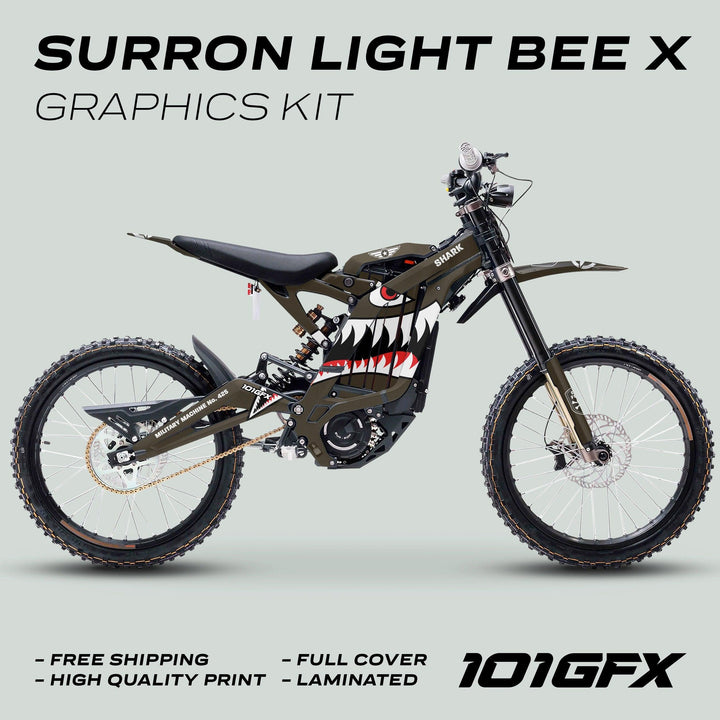Surron Light Bee X Graphics Kit MILITARY SHARK Brown displayed with shark-mouth decal, showcasing promotional highlights: free shipping, high-quality print, full cover, laminated finish.