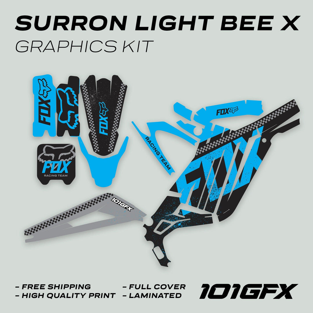 Surron Light Bee X Graphics Kit FOX DUST Black Cyan with FOX logos, black-cyan distressed pattern, includes fork guards, swingarm covers, and side panels for enhanced bike style and protection.