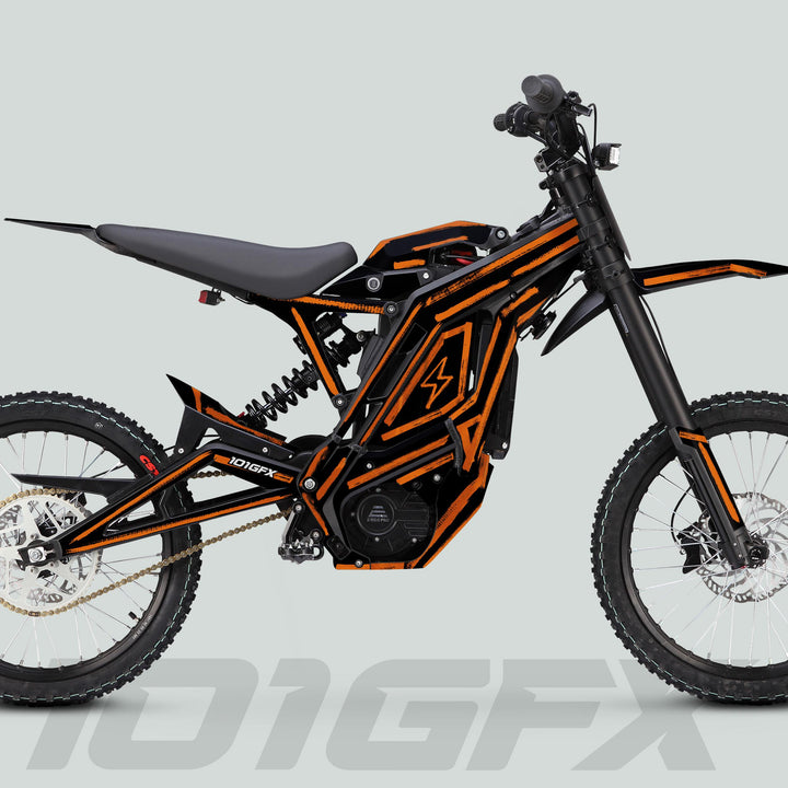 Side profile of an electric dirt bike with black-and-orange frame showcasing the E Ride Pro SS Graphics Kit in Brush Black Orange on the model 101GFX.