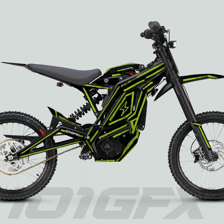 E Ride Pro SS Graphics Kit BRUSH Black Green on a small electric off-road bike, showcasing tubular frame, knobby tires, coil spring shock, and chain drive.