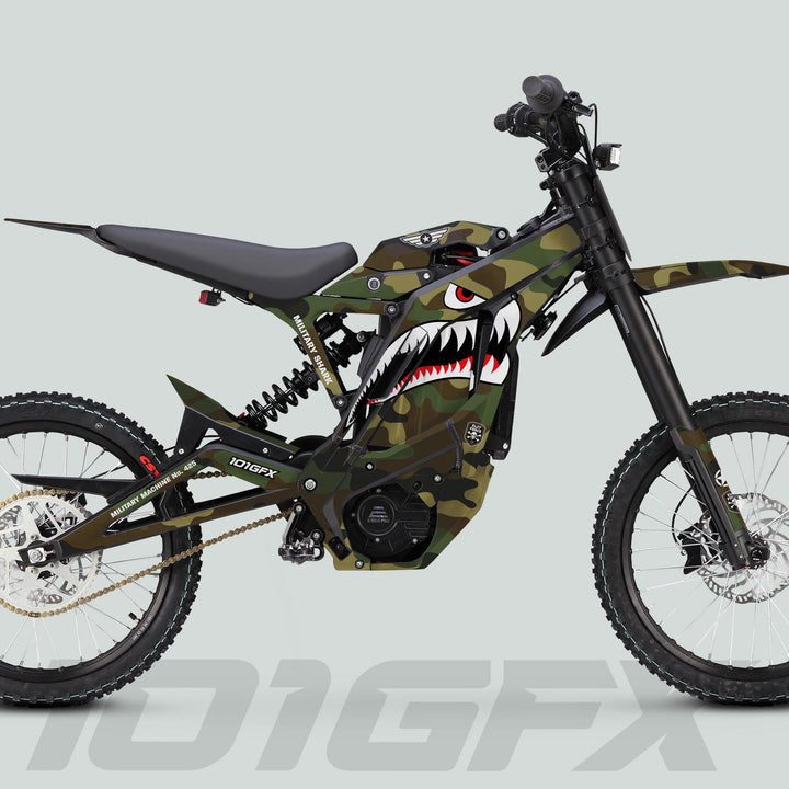E Ride Pro SS Graphics Kit MILITARY SHARK Camo on an off-road e-bike with camo paint, full suspension, knobby tires, and shark-mouth graphic.