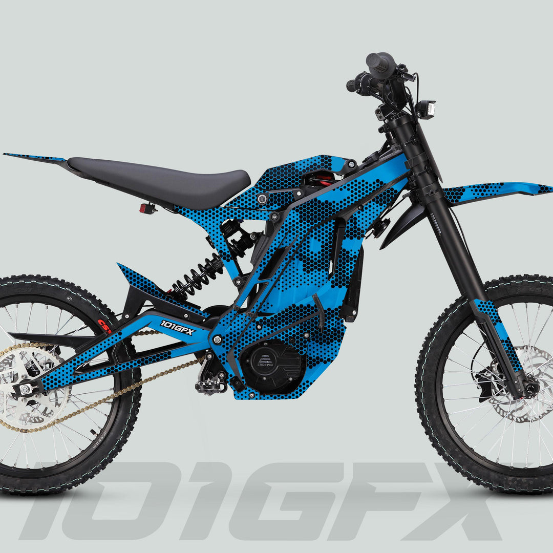 E Ride Pro SS Graphics Kit HEXOCAM CYAN on a blue & black electric off-road motorcycle, featuring a full-suspension frame, knobby tires, and disc brakes.