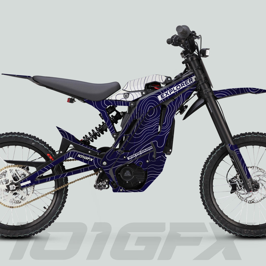 Side-view of E Ride Pro SS Graphics Kit EXPLORER Navy White on an off-road electric bike, showcasing durable decals and streamlined design for enhanced visibility and style.