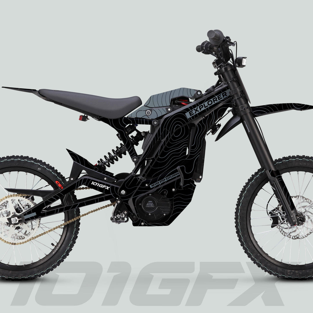 Side view of a black electric off-road motorcycle featuring the E Ride Pro SS Graphics Kit EXPLORER Black Grey, with tubular frame and off-road suspension.
