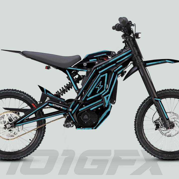 E Ride Pro SS Graphics Kit BRUSH Black Mint on e-dirt bike, showcasing teal panels, tubular frame, and distinct knobby tires for enhanced trail aesthetics.