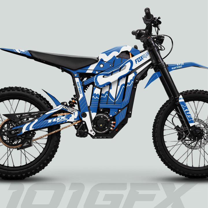 Talaria Sting MX5 PRO Graphics Kit FOX STRIPES on electric MX bike, showcasing blue-and-white Fox Racing livery, knobby tires, and motor housing in side-profile rendering.