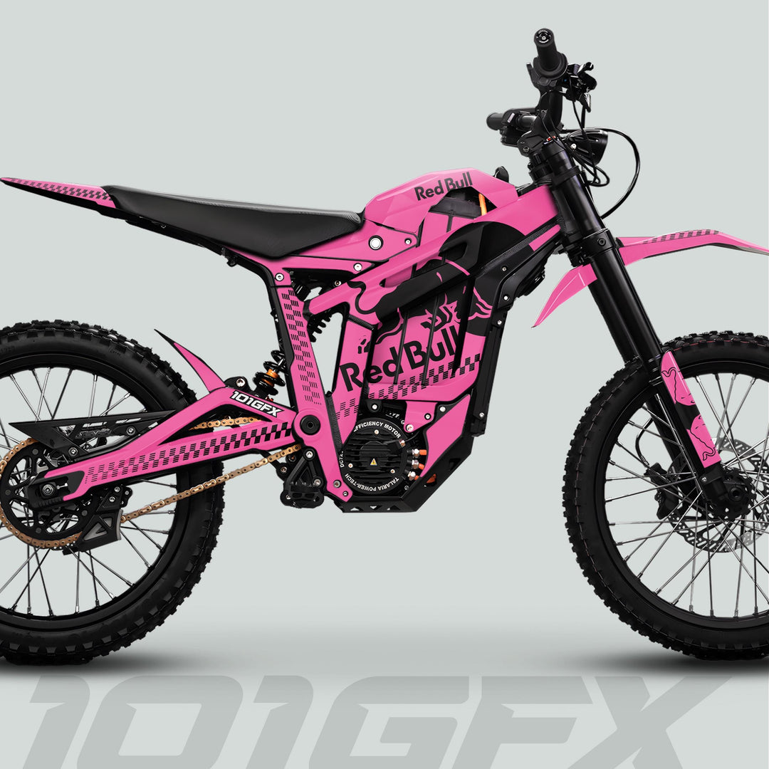 Side-view of Talaria Sting MX5 PRO Graphics Kit RBULL MONO Pink Black Decals on an electric dirt bike with Red Bull branding.