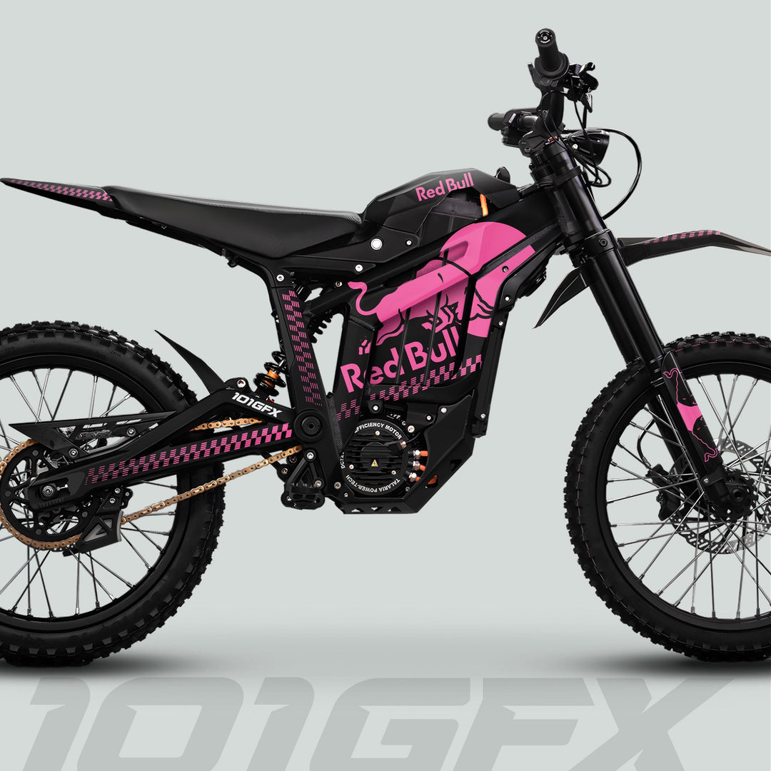 Talaria Sting MX5 PRO Graphics Kit RBULL MONO: Matte black electric bike with pink decals, Red Bull branding, knobby tires, and full suspension.