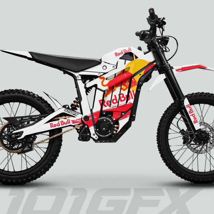 Side-view of Talaria Sting MX5 PRO Graphics Kit featuring Red Bull design, showcasing off-road features like knobby tires, suspension, and electric motor.