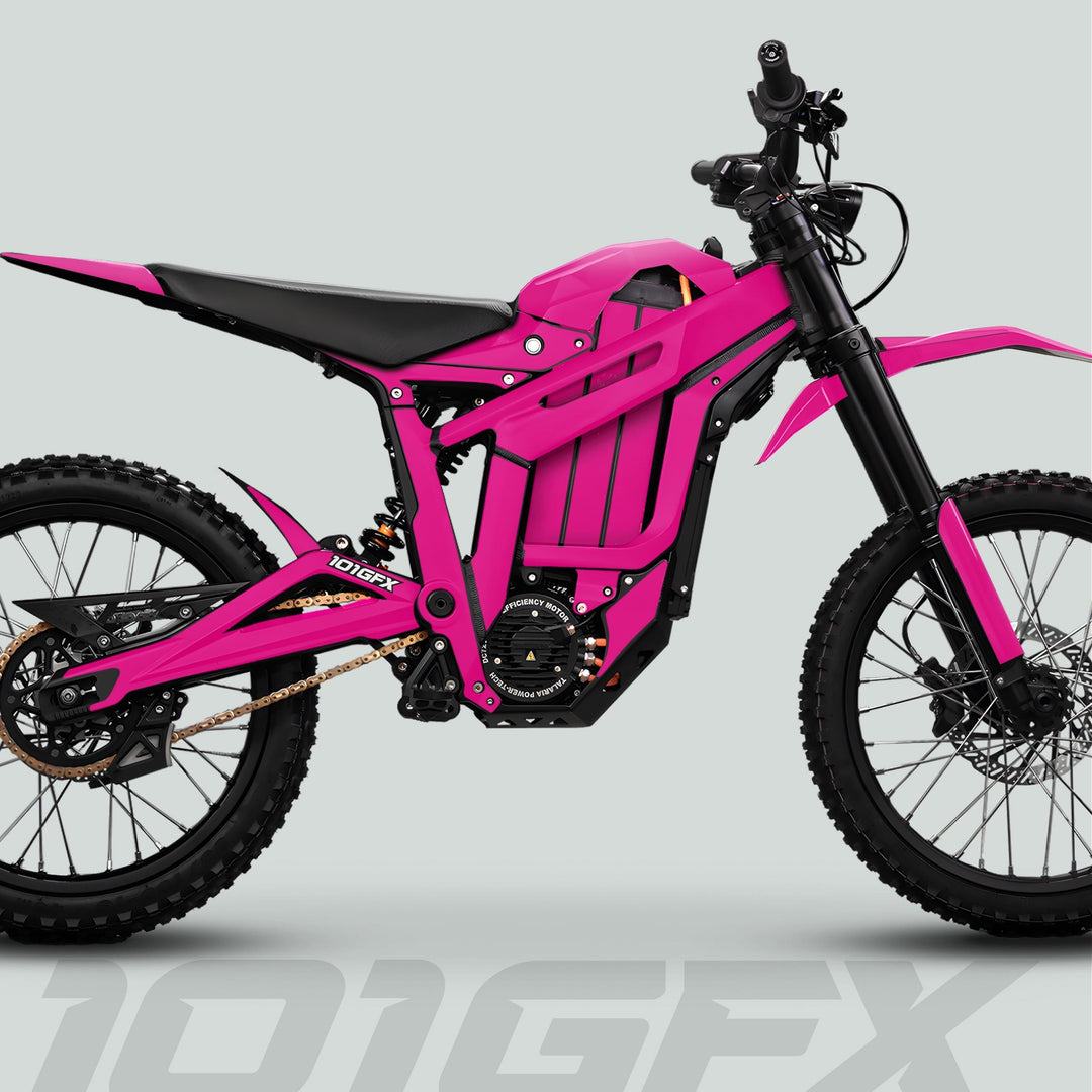 Side-view of Talaria Sting MX5 PRO with SOLID COLOR Magenta Decals, showcasing knobby tires, suspension, electric motor, and single-disc brake.