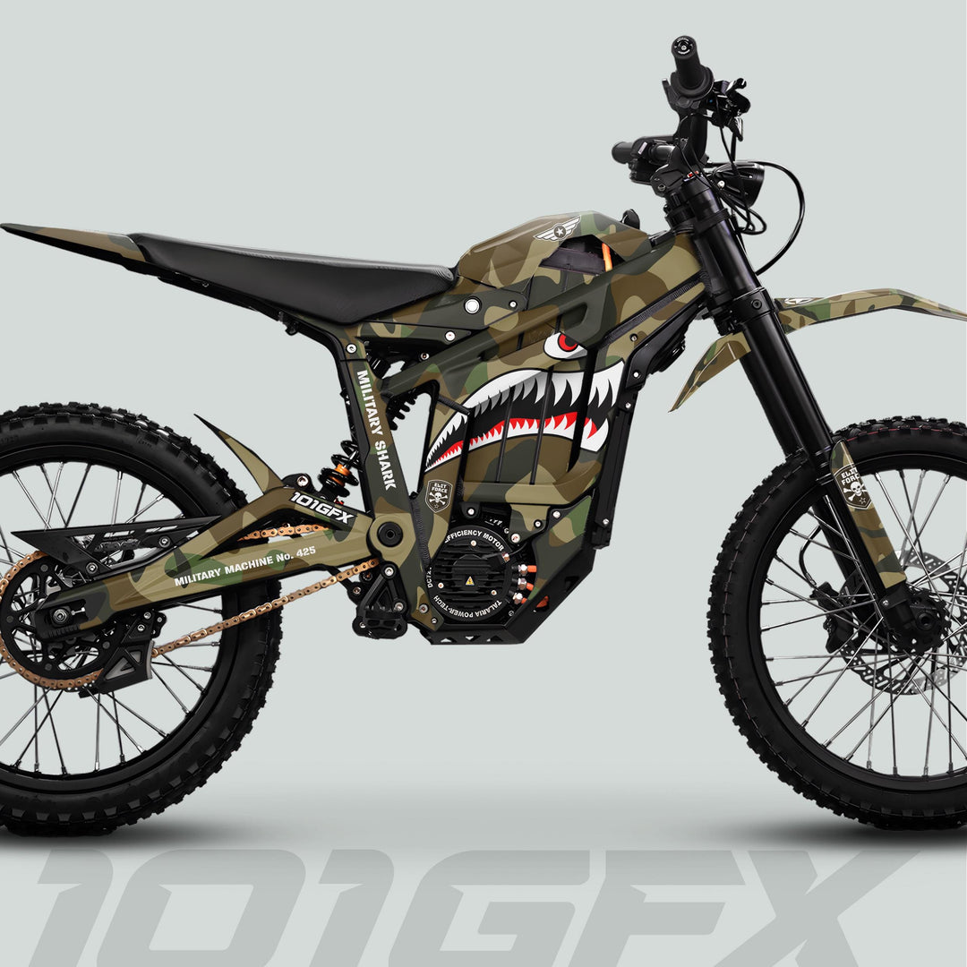 Talaria Sting MX5 PRO Graphics Kit MILITARY SHARK Camo Decals on an electric dirt bike with shark-mouth art, military markings, knobby tires, and disc brakes.