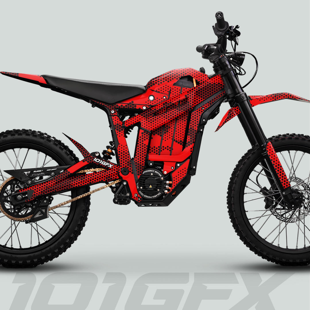 Talaria Sting MX5 PRO Graphics Kit HEXOCAM RED Decals on a futuristic off-road electric motorcycle, enhancing its style with a red honeycomb pattern.