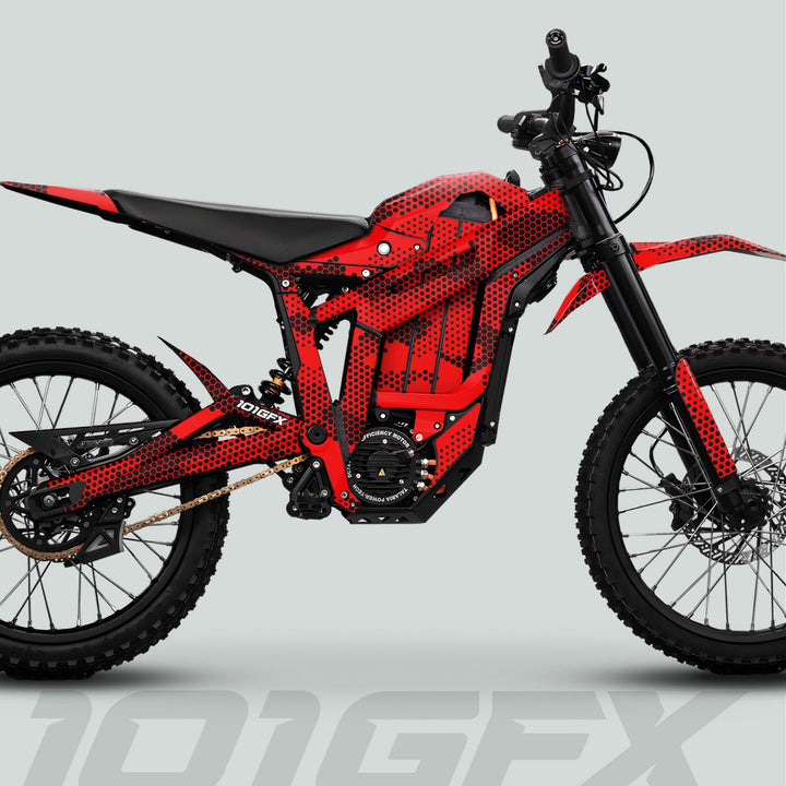 Talaria Sting MX5 PRO Graphics Kit HEXOCAM RED Decals on a futuristic off-road electric motorcycle, enhancing its style with a red honeycomb pattern.