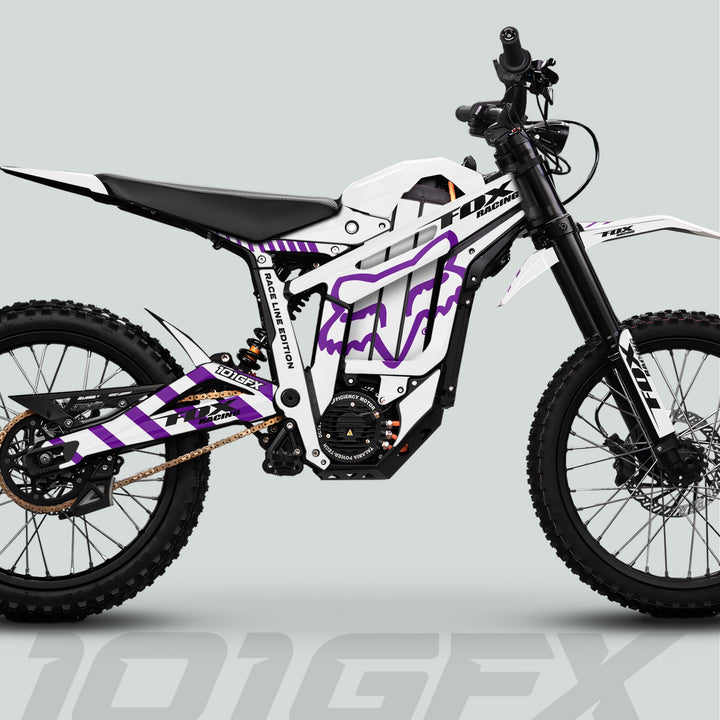 Talaria Sting MX5 PRO Graphics Kit with FOX RACELINE decals on an e-dirtbike, highlighting stylish design, knobby tires, and sleek structure.