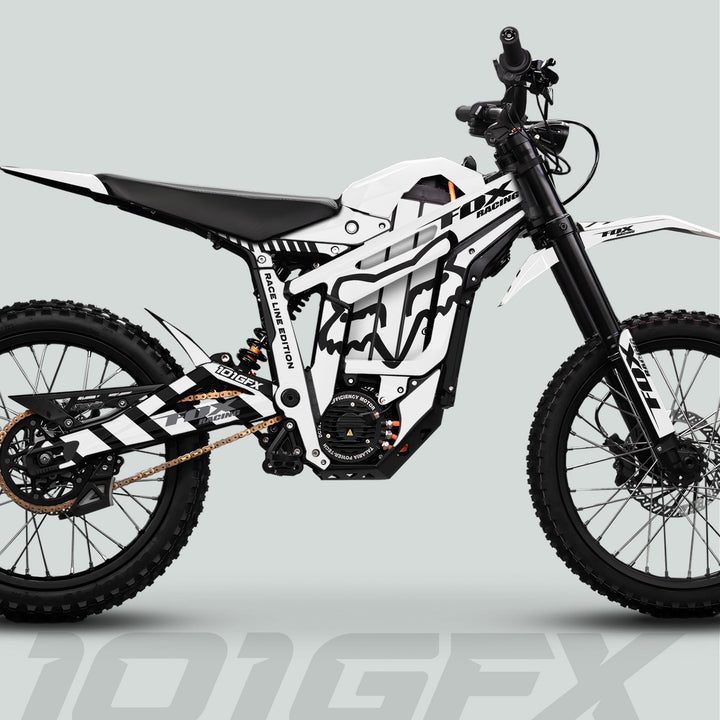 Talaria Sting MX5 PRO Graphics Kit features FOX RACELINE white-black decals on an electric dirt bike with off-road-ready design and components.