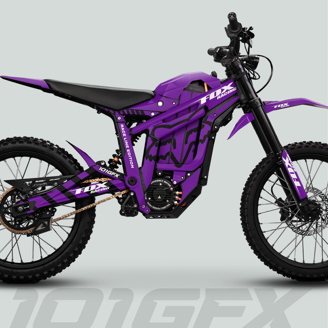 Side-view of a purple electric dirt-bike with Talaria Sting MX5 PRO Graphics Kit featuring FOX RACELINE decals, highlighting motocross design elements and sturdy build.