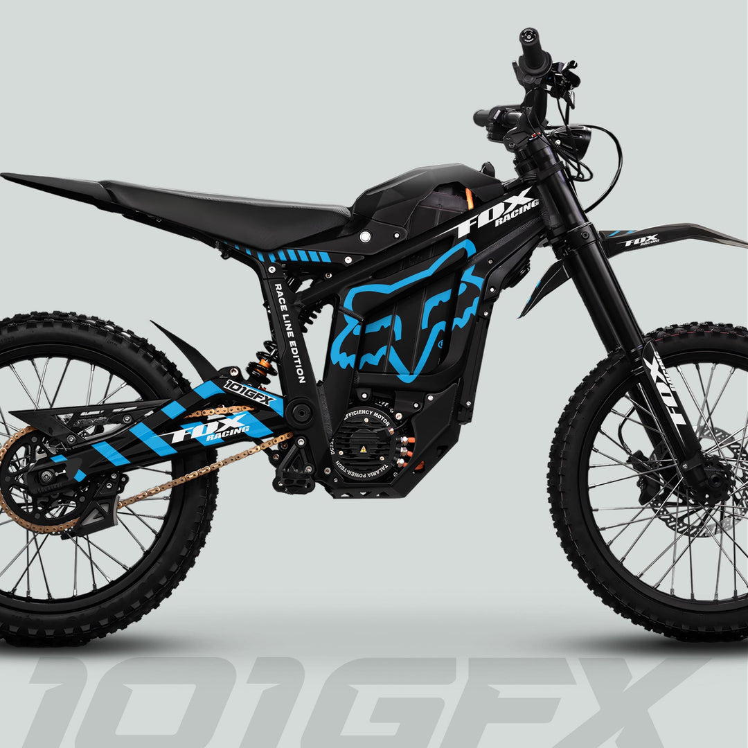 Talaria Sting MX5 PRO Graphics Kit featuring FOX RACELINE Black Cyan Decals on an off-road electric dirt bike with moto-style frame and gold drive chain.