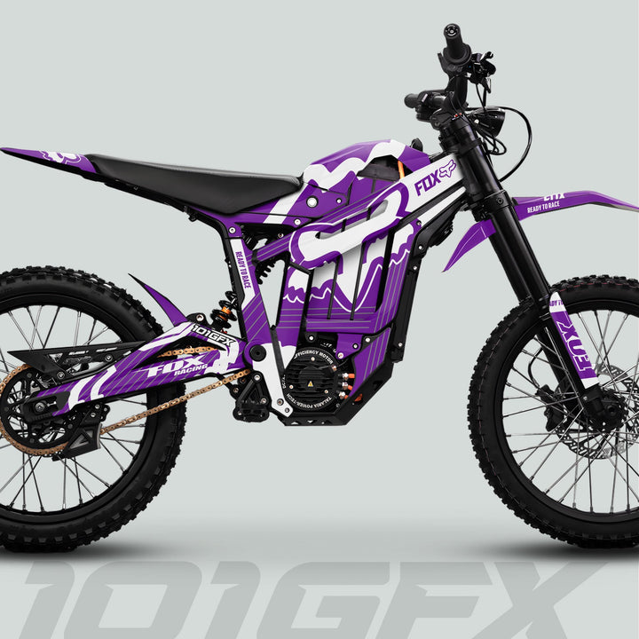Talaria Sting MX5 PRO Graphics Kit features purple-and-white FOX STRIPES on an electric dirt bike with durable decals, enhancing off-road style and protection.