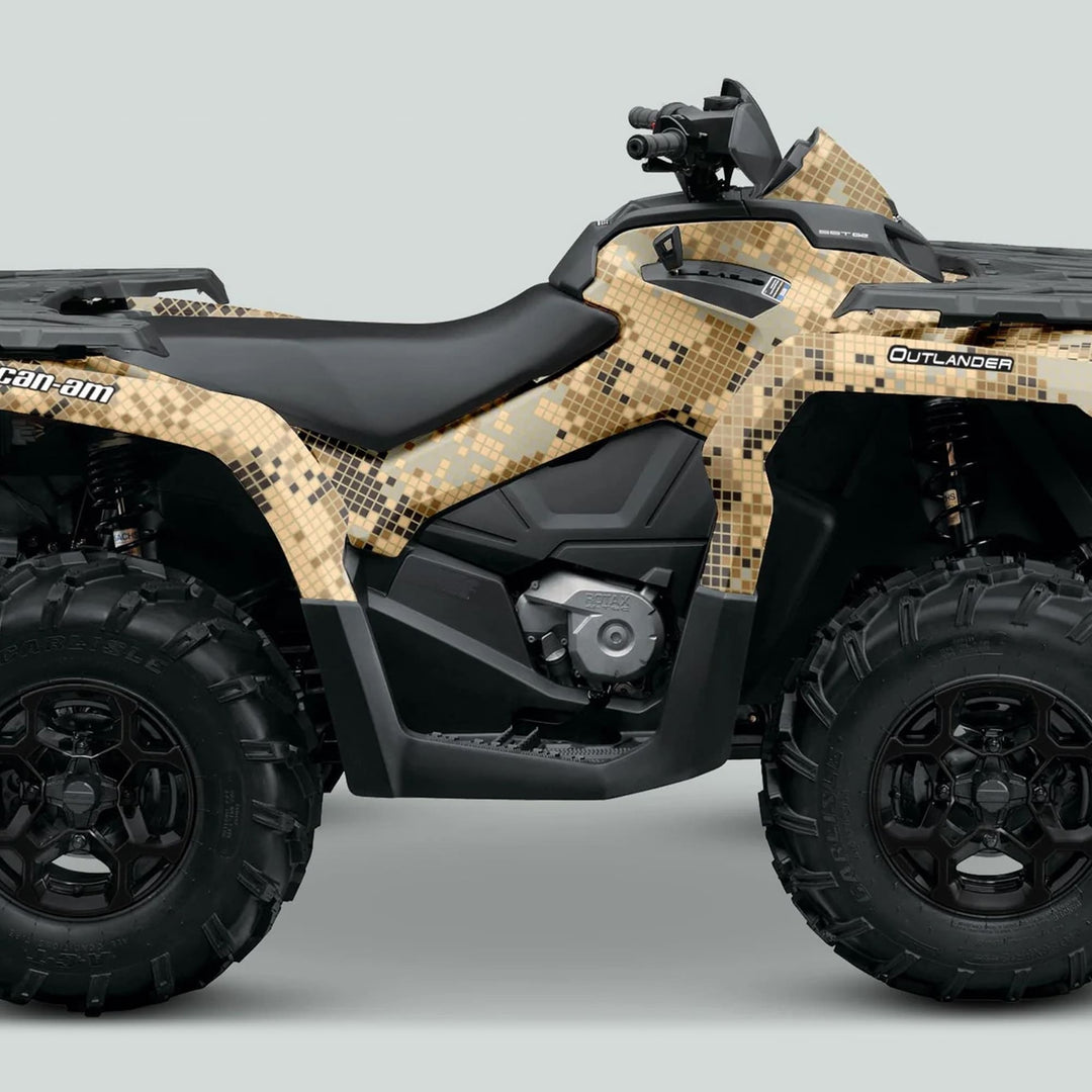 Side view of a Can-Am Outlander featuring the DIGITAL CAMO Sand graphics kit with tan/khaki camo panels and black off-road tires.
