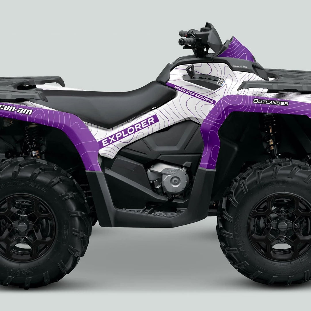 Side view of Can-Am OUTLANDER G2 Graphics Kit EXPLORER White Purple on ATV, featuring topographic contour-line graphics and slogan “Never Stop Exploring.”