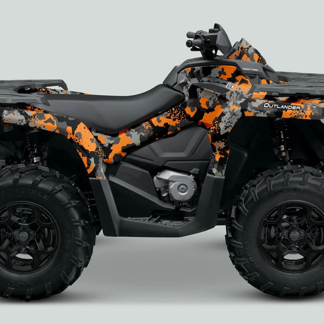 Side-view of an ATV with the Can-Am OUTLANDER Graphics kit SPLAT CAMO Orange, featuring a camo body wrap, chunky off-road tires, and sleek design.