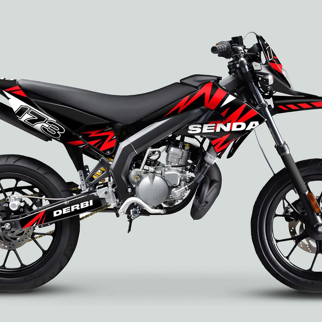 Derbi Senda Graphics Kit X-Treme 2011-2017 on a supermoto-style bike, showcasing durable vinyl decals with lightning black and red design for improved aesthetics and performance.