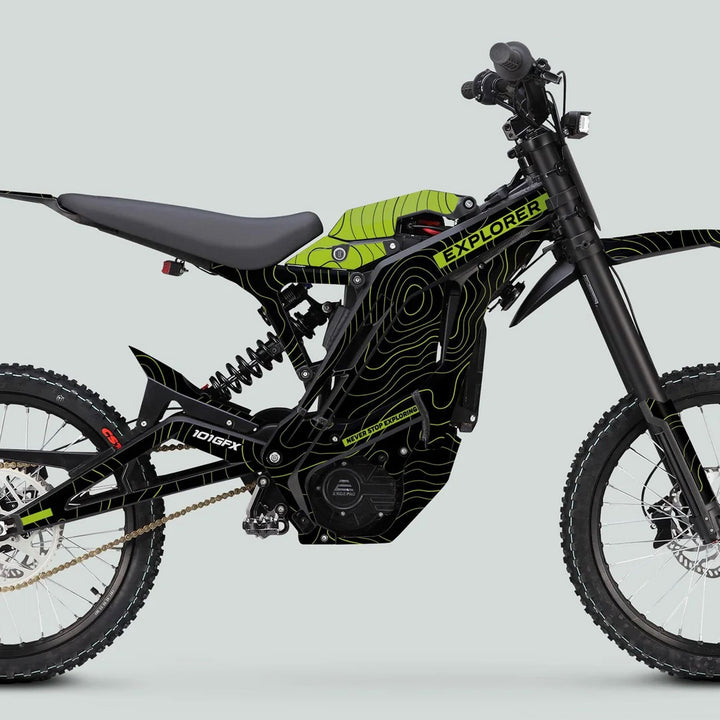 Electric off-road motorcycle side view with E Ride Pro SS Graphics Kit EXPLORER Black Green, featuring contour-map lines, “Never Stop Exploring” slogan, and “E-Ride Pro” labeled motor housing.