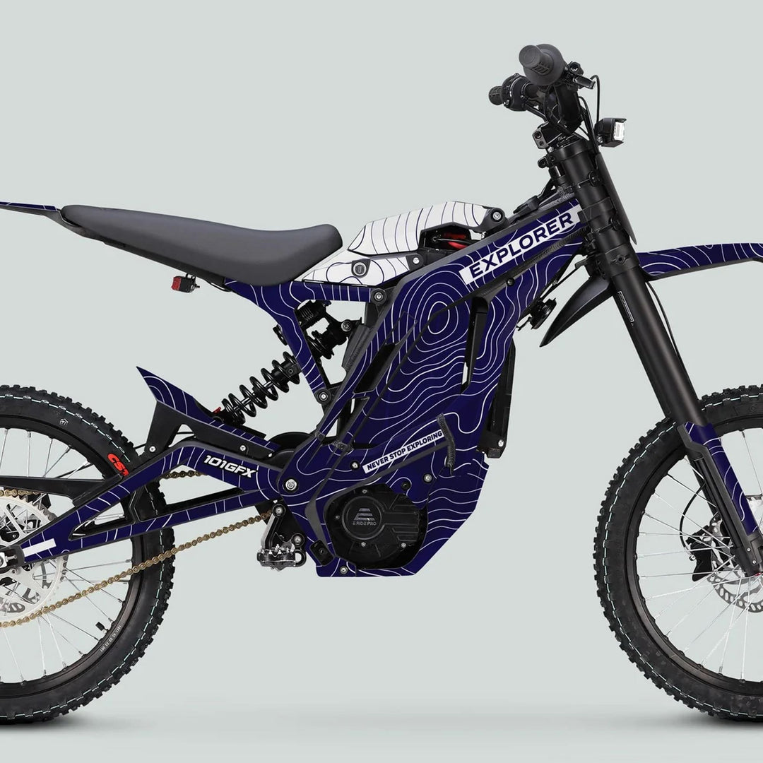 Side-view of E Ride Pro SS Graphics Kit EXPLORER Navy White on an electric off-road motorcycle, showcasing rugged design, durable vinyl graphics, and enhanced visibility features.