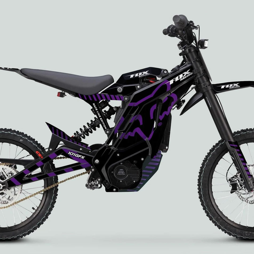 Side-profile of an E Ride Pro SS Graphics Kit FOX Race Line Black Purple on an off-road electric dirt bike, showcasing durable, stylish decals for enhanced aesthetic.