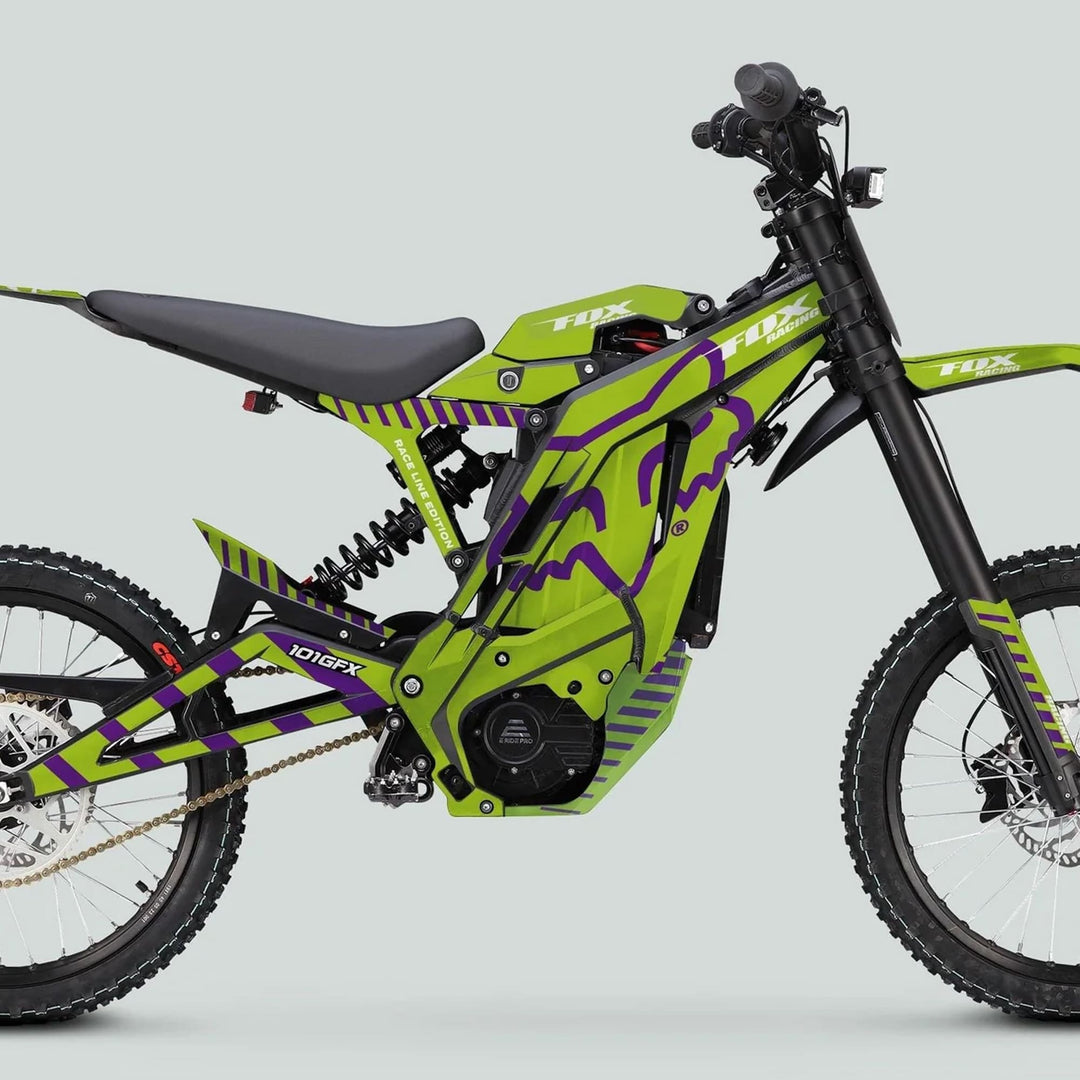 Side profile of E Ride Pro SS Graphics Kit FOX Race Line Green Purple on an electric off-road bike, highlighting its vibrant livery and durable design.