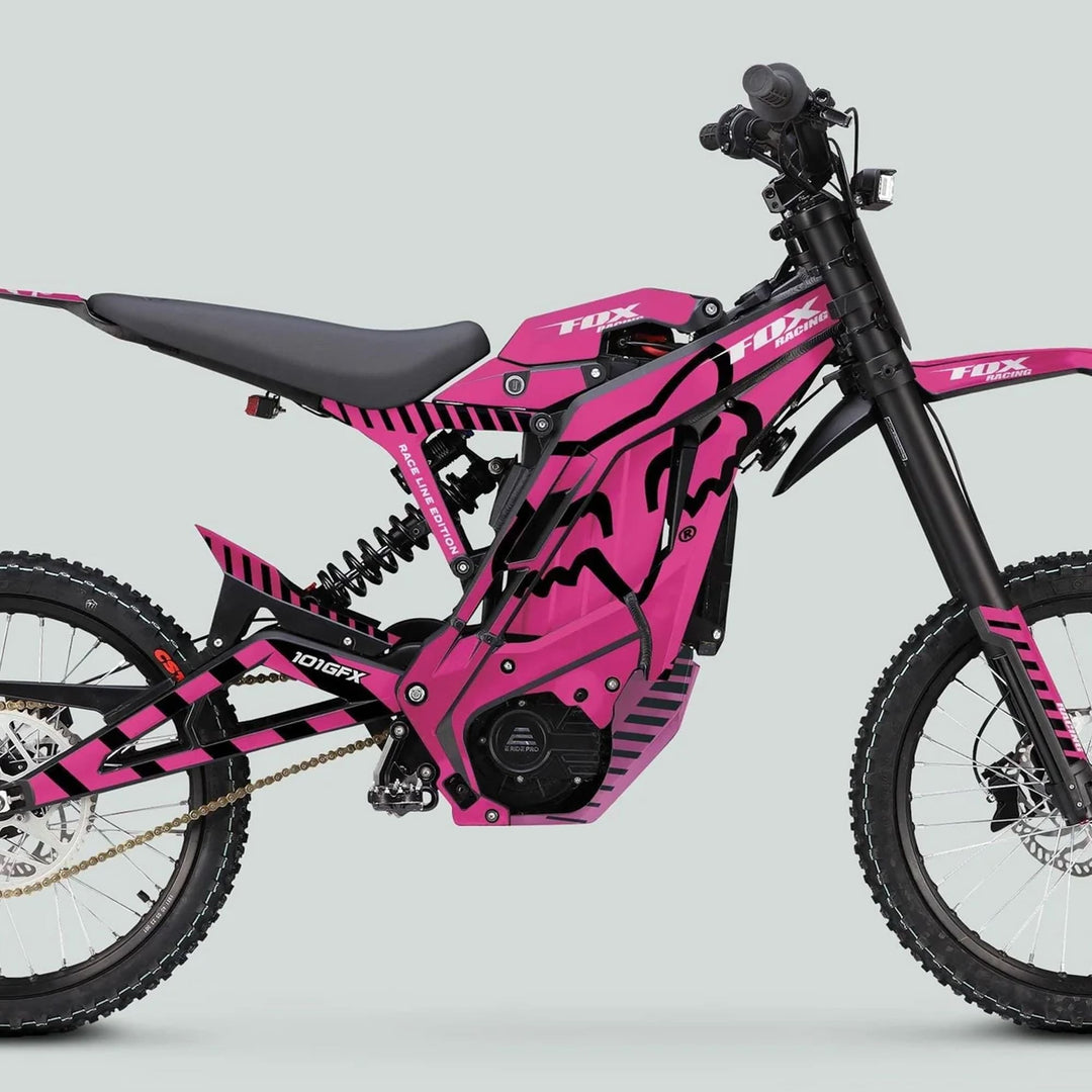 Side profile of a pink off-road electric dirt bike featuring the E Ride Pro SS Graphics Kit FOX Race Line Pink Black, showcasing bold graphics and durable design.
