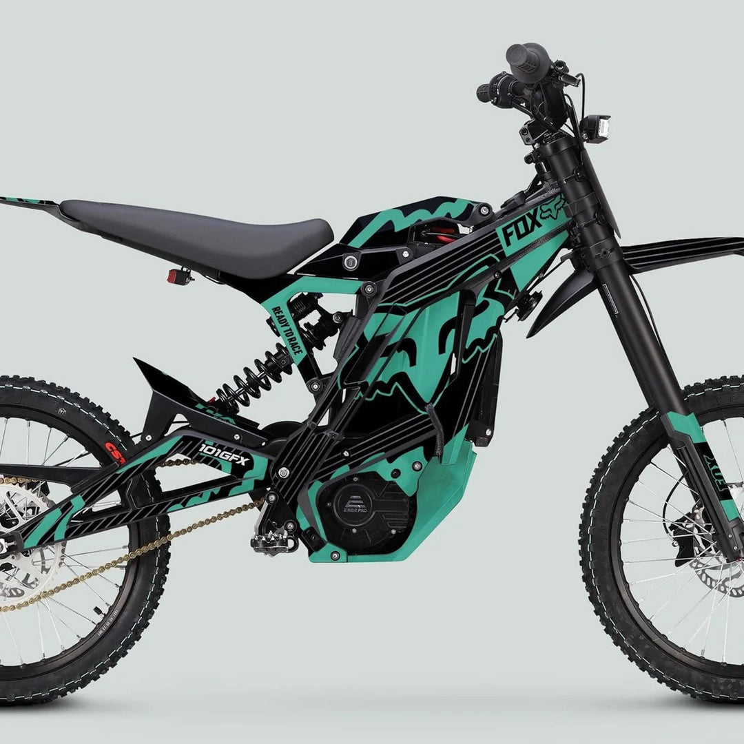E Ride Pro SS Graphics Kit FOX R Stripes Black Mint on teal and black off-road electric dirt bike, showcasing sleek design and durability.