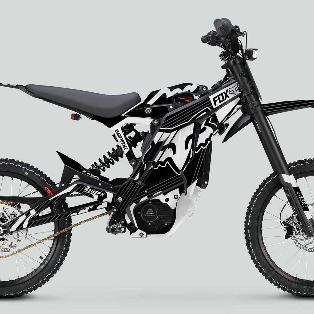 E Ride Pro SS Graphics Kit features FOX R stripes on a motocross electric dirt bike with knobby tires, showcasing style and durability.