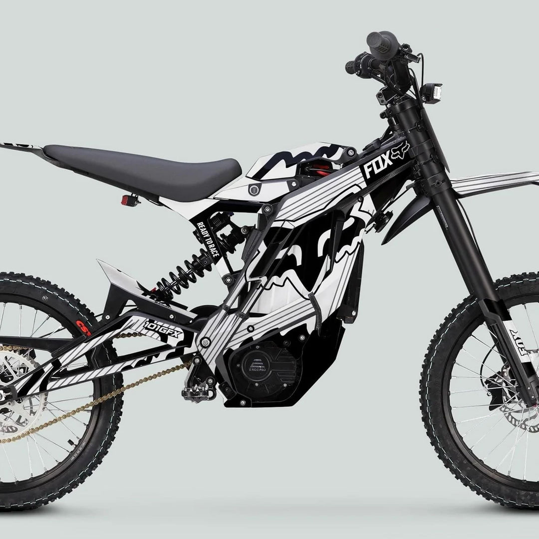 E Ride Pro SS Graphics Kit FOX R Stripes White Black on an electric dirt bike, featuring bold stripes, designed for easy application and enhanced style.